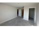 Simple bedroom with neutral walls and tile flooring, ready for personalization at 4445 Sw 90Th Pl, Ocala, FL 34476