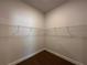 Large walk-in closet with wire shelving and carpet at 4461 Sw 90Th Pl, Ocala, FL 34476