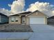 New construction home with attached garage and neutral color scheme at 4477 Sw 90Th Pl, Ocala, FL 34476