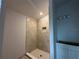 Walk-in shower with tile surround at 4477 Sw 90Th Pl, Ocala, FL 34476