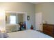 Bedroom with mirrored closet doors and window at 4707 River Ridge Dr, Leesburg, FL 34748