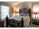 Bedroom with a metal framed bed and nightstands at 4707 River Ridge Dr, Leesburg, FL 34748