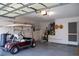 Garage with golf cart and additional storage at 4707 River Ridge Dr, Leesburg, FL 34748