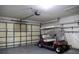 Garage with golf cart and storage shelving at 4707 River Ridge Dr, Leesburg, FL 34748