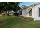 House exterior showcasing landscaping and a side view at 4707 River Ridge Dr, Leesburg, FL 34748