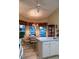 Bright kitchen nook with table and chairs, overlooking a peaceful view at 4707 River Ridge Dr, Leesburg, FL 34748
