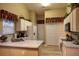 Well-equipped kitchen with white cabinets, ample counter space, and modern appliances at 4707 River Ridge Dr, Leesburg, FL 34748