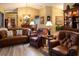 Living room with leather furniture, hardwood floors, and fireplace at 4707 River Ridge Dr, Leesburg, FL 34748