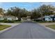 Residential street lined with houses and lush landscaping at 4707 River Ridge Dr, Leesburg, FL 34748