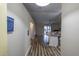 View of entryway with wood-look floors and view into living room at 5310 Nw 61St Ln, Ocala, FL 34482