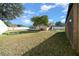 Spacious backyard with large grassy area and shed at 6931 Se 54Th St, Ocala, FL 34472