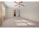 Bedroom with ceiling fan and en-suite bathroom at 6931 Se 54Th St, Ocala, FL 34472