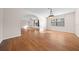 Bright dining room with wood floors and view to living room at 6931 Se 54Th St, Ocala, FL 34472
