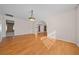 Open dining room with wood floors and archway at 6931 Se 54Th St, Ocala, FL 34472