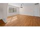 Spacious dining room with wood-look flooring and large window at 6931 Se 54Th St, Ocala, FL 34472