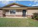 Home's front entrance with stone accents and landscaping at 6931 Se 54Th St, Ocala, FL 34472