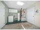 Garage with washer, dryer, water heater, and storage at 6931 Se 54Th St, Ocala, FL 34472
