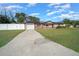 Single-Gathering home with driveway, garage, and solar panels at 6931 Se 54Th St, Ocala, FL 34472