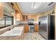Kitchen boasts stainless steel appliances and ample cabinetry at 6931 Se 54Th St, Ocala, FL 34472
