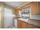 Bright kitchen features double sink, dishwasher, and ample wood cabinets at 6931 Se 54Th St, Ocala, FL 34472