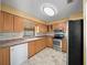 Kitchen with light wood cabinets and stainless steel appliances at 6931 Se 54Th St, Ocala, FL 34472