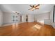 Open concept living area with hardwood floors and access to the patio at 6931 Se 54Th St, Ocala, FL 34472