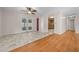 Spacious living room with hardwood floors and tile flooring by patio doors at 6931 Se 54Th St, Ocala, FL 34472