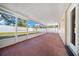Spacious screened patio overlooking backyard at 6931 Se 54Th St, Ocala, FL 34472