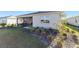 House with a screened porch, well-manicured landscaping, and grassy yard at 9002 Sw 75Th Loop, Ocala, FL 34481