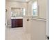 Elegant bathroom with glass shower, double vanity, and modern fixtures at 9002 Sw 75Th Loop, Ocala, FL 34481