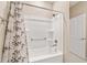Bathroom featuring a shower/tub combo, neutral color palette, and a patterned shower curtain at 9002 Sw 75Th Loop, Ocala, FL 34481