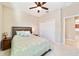 Cozy bedroom with ceiling fan, double closet, and neutral decor at 9002 Sw 75Th Loop, Ocala, FL 34481