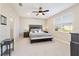 Spacious bedroom with carpeted floors and ceiling fan at 9002 Sw 75Th Loop, Ocala, FL 34481