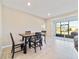 Bright dining room with sliding glass doors leading to a screened patio at 9002 Sw 75Th Loop, Ocala, FL 34481