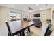 Casual dining area with a table and chairs near the living room and access to back patio at 9002 Sw 75Th Loop, Ocala, FL 34481