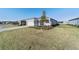 One story house with gray exterior, two car garage, and grassy yard at 9002 Sw 75Th Loop, Ocala, FL 34481