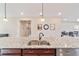 Modern kitchen island with granite countertop and double sink at 9002 Sw 75Th Loop, Ocala, FL 34481