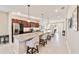 Modern kitchen with granite countertops, stainless steel appliances, and an island with seating at 9002 Sw 75Th Loop, Ocala, FL 34481