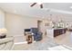 Open floor plan boasts a spacious kitchen with island and a cozy living room with reclining chairs at 9002 Sw 75Th Loop, Ocala, FL 34481