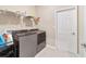 Laundry room with washer, dryer, and additional shelving for storage at 9002 Sw 75Th Loop, Ocala, FL 34481