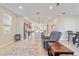 Spacious living room features open floor plan with kitchen, island and access to dining area at 9002 Sw 75Th Loop, Ocala, FL 34481