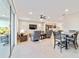 Open living room with tile floors, recessed lighting, and sliding glass doors leading to the patio at 9002 Sw 75Th Loop, Ocala, FL 34481