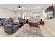 Spacious living room offers comfortable seating, large windows and access to the back patio at 9002 Sw 75Th Loop, Ocala, FL 34481