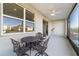 Covered patio with outdoor seating and a view of the backyard at 9002 Sw 75Th Loop, Ocala, FL 34481