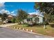 One-story home with light green exterior and well-maintained landscaping at 9257 Sw 94Th Loop, Ocala, FL 34481