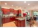 Modern kitchen featuring stainless steel appliances and granite island at 9257 Sw 94Th Loop, Ocala, FL 34481