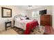 Charming bedroom with a full-size bed and wooden furniture at 10195 Se 178Th Pl, Summerfield, FL 34491