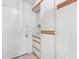 Functional laundry room with built-in cabinetry and exterior access at 10195 Se 178Th Pl, Summerfield, FL 34491