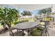 Relaxing patio with an outdoor dining set and grill at 10195 Se 178Th Pl, Summerfield, FL 34491