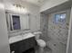 Modern bathroom with a large marble shower and updated vanity at 11179 Sw 78Th Ct, Ocala, FL 34476